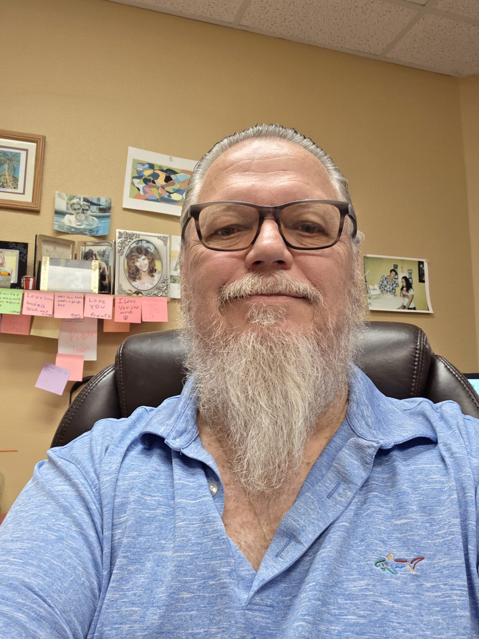 Bernie Edwards sitting at his desk
